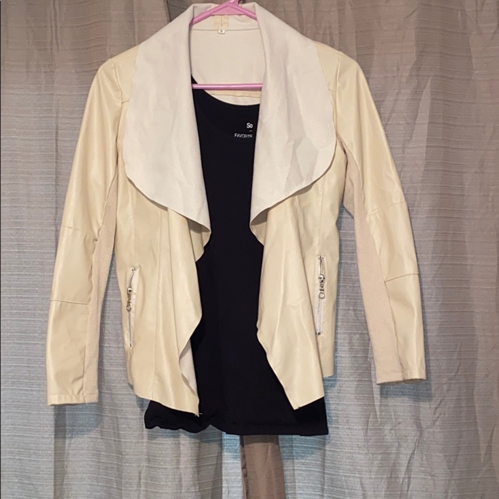 Cream faux leather jacket.